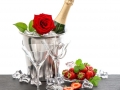 festive arrangement with champagne, red rose and strawberries