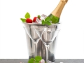 bottle of champagne and two glasses over white background