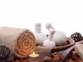 Spa massage border with rolled towel and compress balls