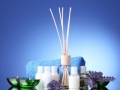Bottle of air freshener, lavander, towel and candles